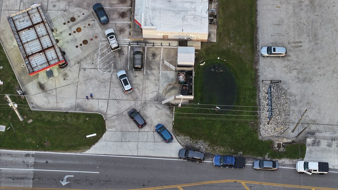 An aerial view of vehicles lined up to wait for gas at a Circle K station on October 11, 2024, in Englewood, Florida. Florida gas stations are out of fuel following the storm that made landfall as a Category 3 hurricane in the Siesta Key area of Florida, causing damage and flooding throughout Central Florida.